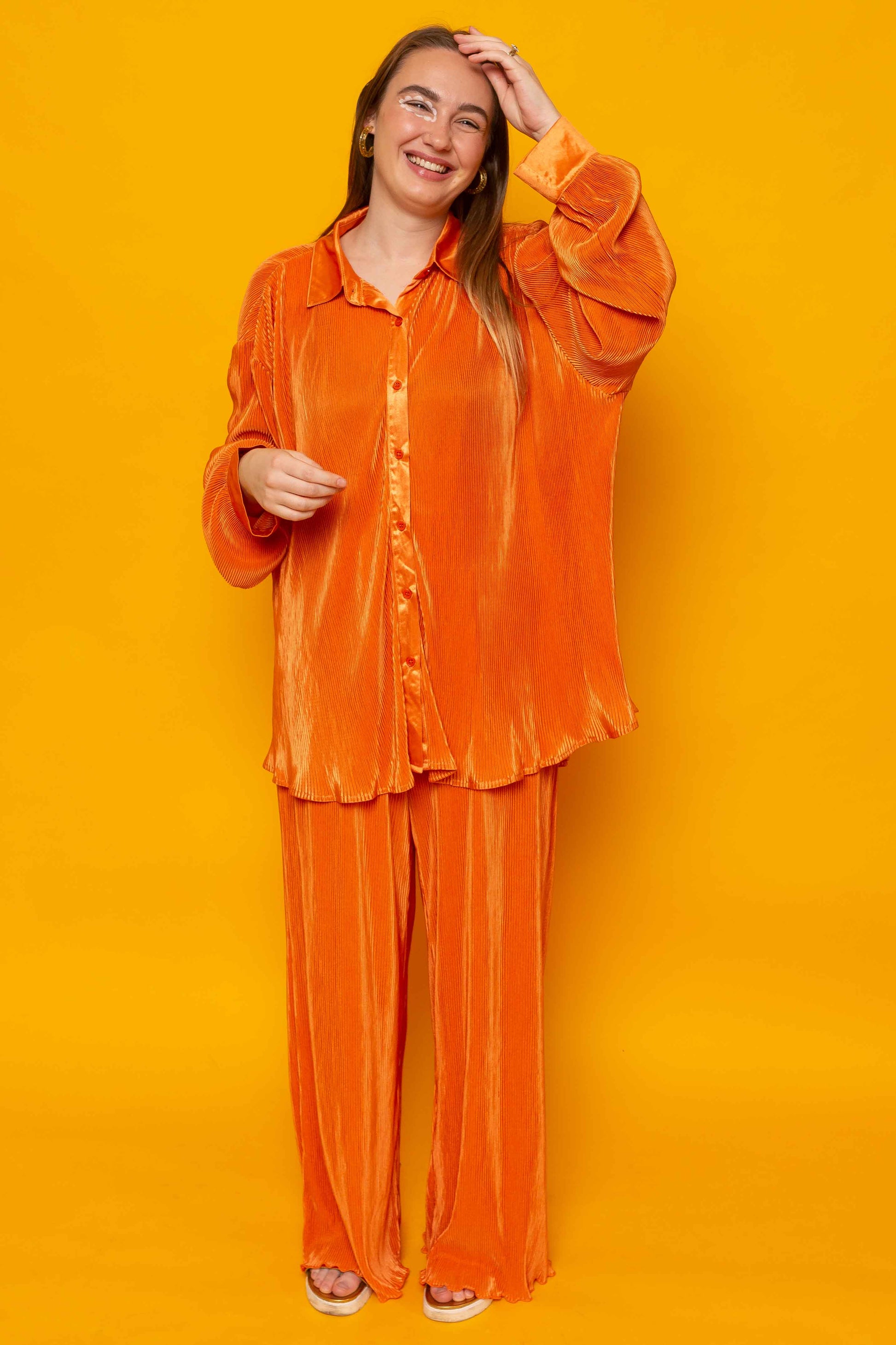 This is The Remix Trousers IT’S OK TO BE SELFISH - Satin Pleated Wide Leg Trousers In Bright Orange